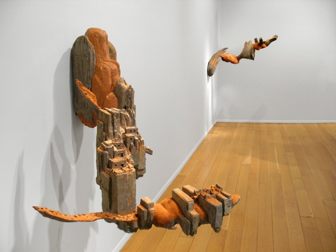 Foreground: Two Streams, 2011, clay, plaster, polyurethane, stones, and sand, 37 x 38 x 37 in.  Background: Arabesque, 2011, plaster, clay, metal, polyurethane, 37 x 24 x 54 in. Photo courtesy www.charles-simonds.com.