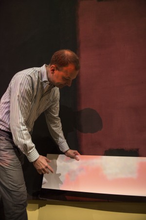 Stenger demonstrates how projected light alters the canvas's color. Photograph by Jim Harrison. From: Francesca Annicchiarico, "Rarely Seen Rothkos Highlight Harvard Art Museums’ Reopening." Harvard Magazine, May 20, 2014. http://harvardmagazine.com/2014/05/rothkos-highlight-art-museums-reopening